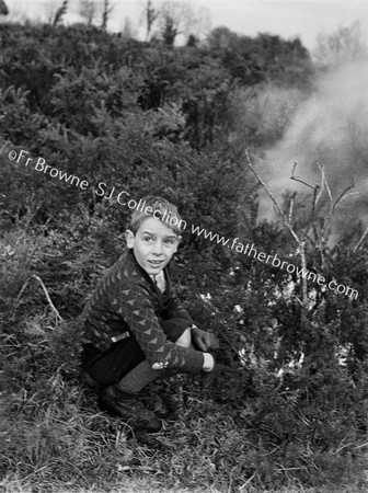 BOY LIGHTING BONFIRE